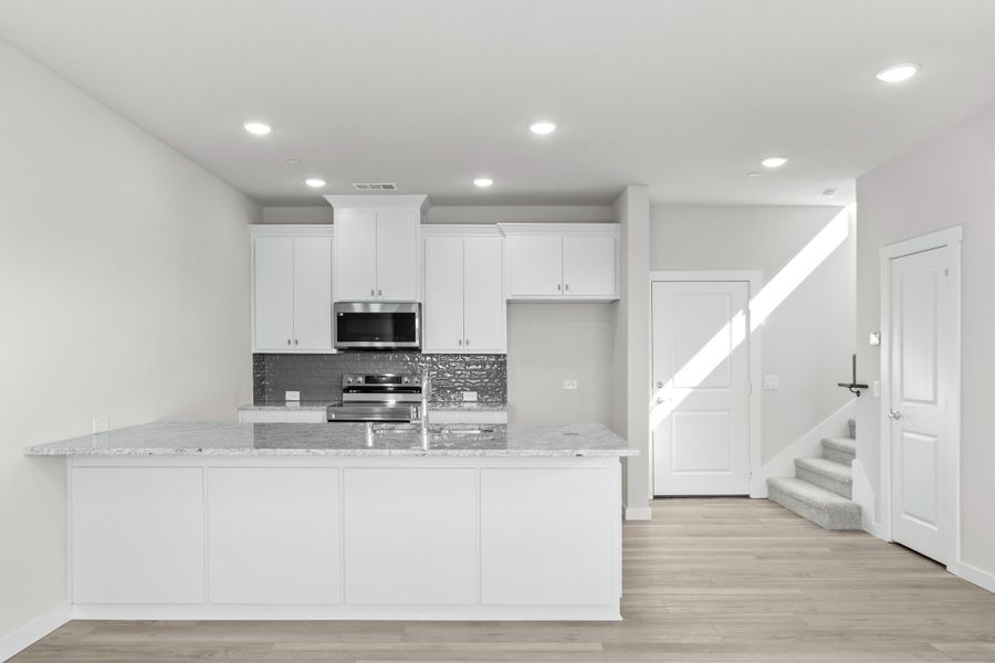 Furnished interior view inside a new home in Wildridge, Oak Point (Image 5).