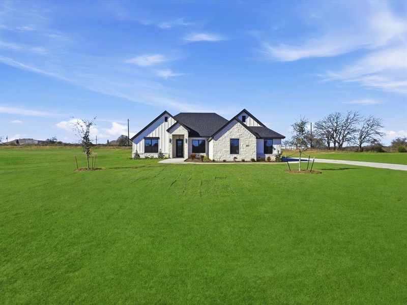 Front exterior of a new home in , Azle, TX, highlighting curb appeal (Image 27).