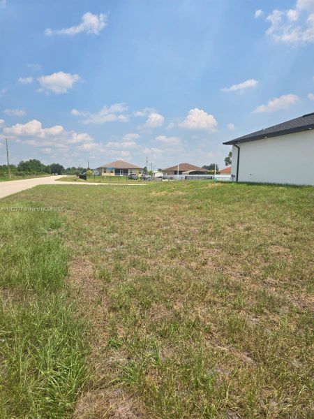 Front exterior of a new home in , Lehigh Acres, FL, highlighting curb appeal (Image 2). Front exterior of a new home in , Lehigh Acres, FL, highlighting curb appeal (Image 2).