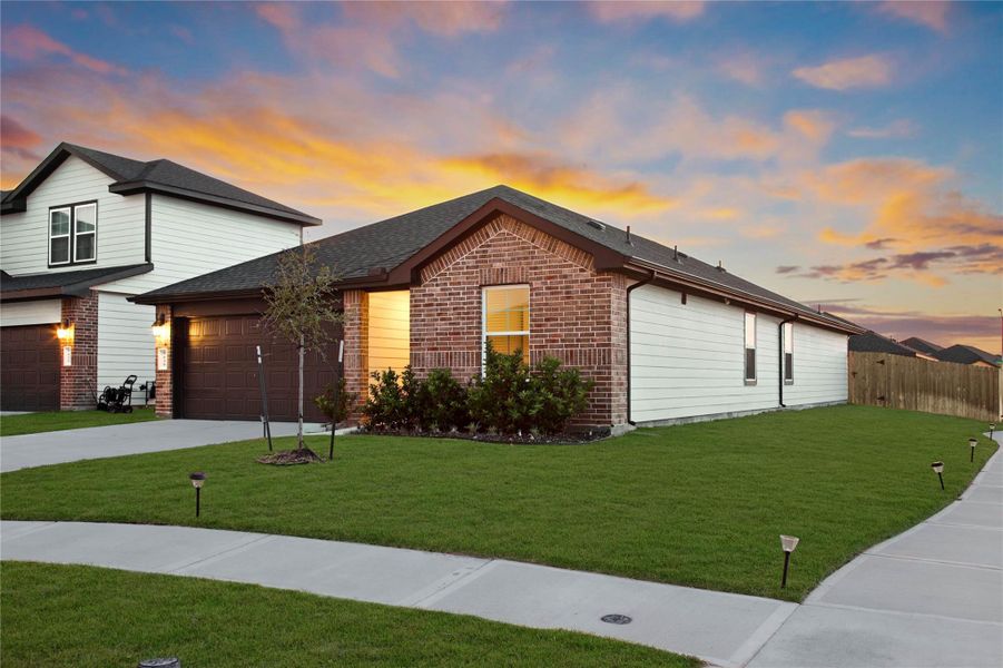 Front exterior of a new home in Sorrento, Richmond, TX, highlighting curb appeal (Image 26).