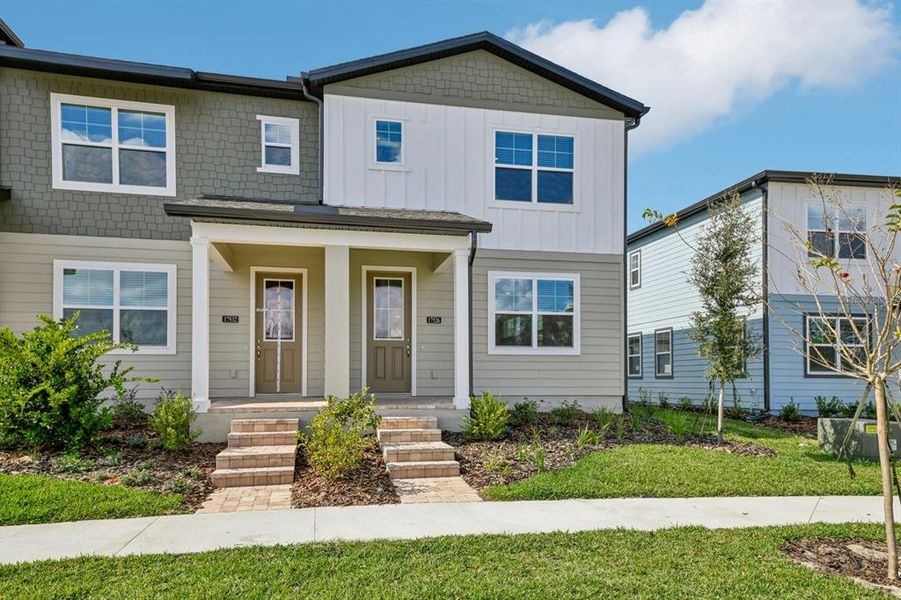 Front exterior of a new home in , Winter Garden, FL, highlighting curb appeal (Image 2).