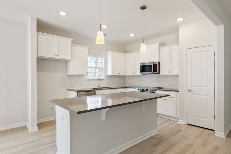 Furnished interior view inside a new home in Landing at Pine Lake, Anderson (Image 6).