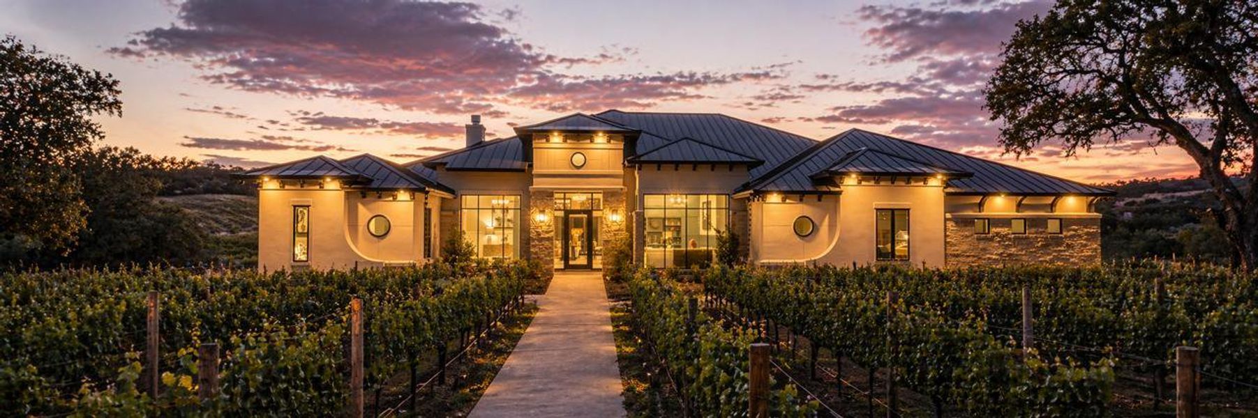 Contemporary-style residence featuring a stone and vertical siding exterior