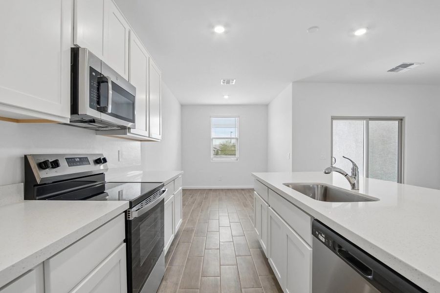 Kitchen and dining. Representative images and renderings are for illustrative purposes. Actual structural options and design finishes of home may vary. Kitchen and dining. Representative images and renderings are for illustrative purposes. Actual structural options and design finishes of home may vary.