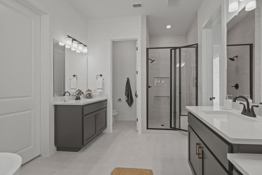 Representative furnished interior of a home built from the Silas by Chesmar Homes in 6 Creeks, Kyle (Image 17).