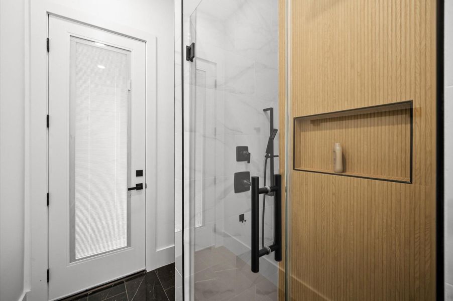 Secondary full bathroom offers modern finishes and designer-selected fixtures.