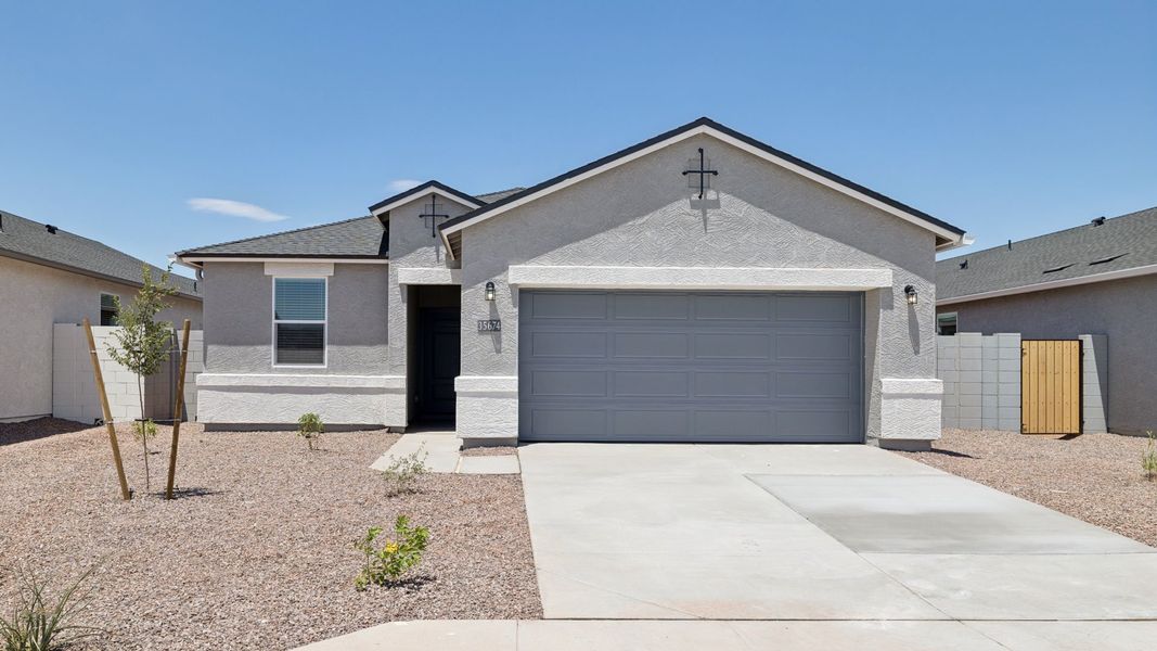 Front exterior of a new home in Quail Ranch, San Tan Valley, AZ, highlighting curb appeal (Image 1). Front exterior of a new home in Quail Ranch, San Tan Valley, AZ, highlighting curb appeal (Image 1).