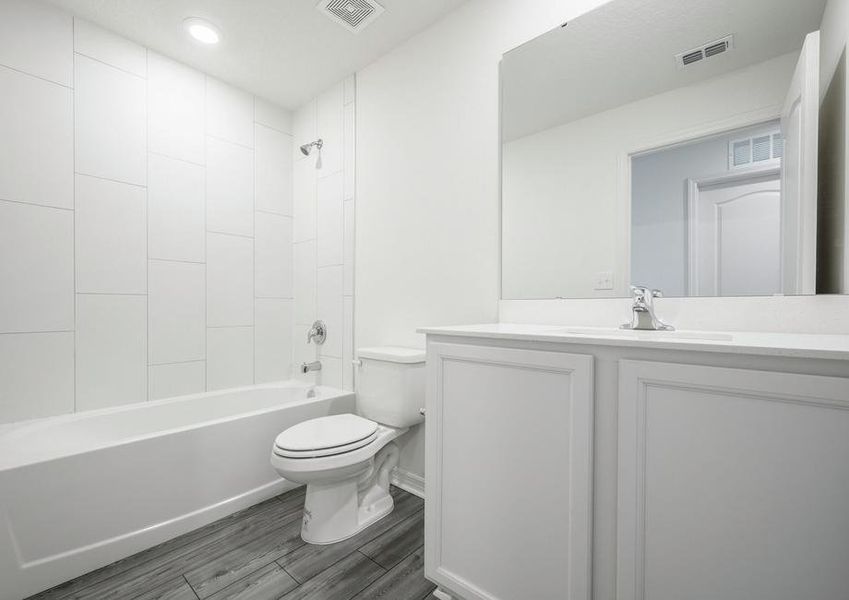 The guest bathroom has a large vanity and is ready for your guests