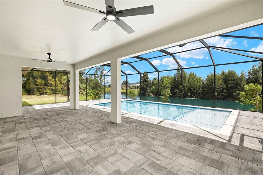 Large lanai area with pavers and canal/pool view Large lanai area with pavers and canal/pool view