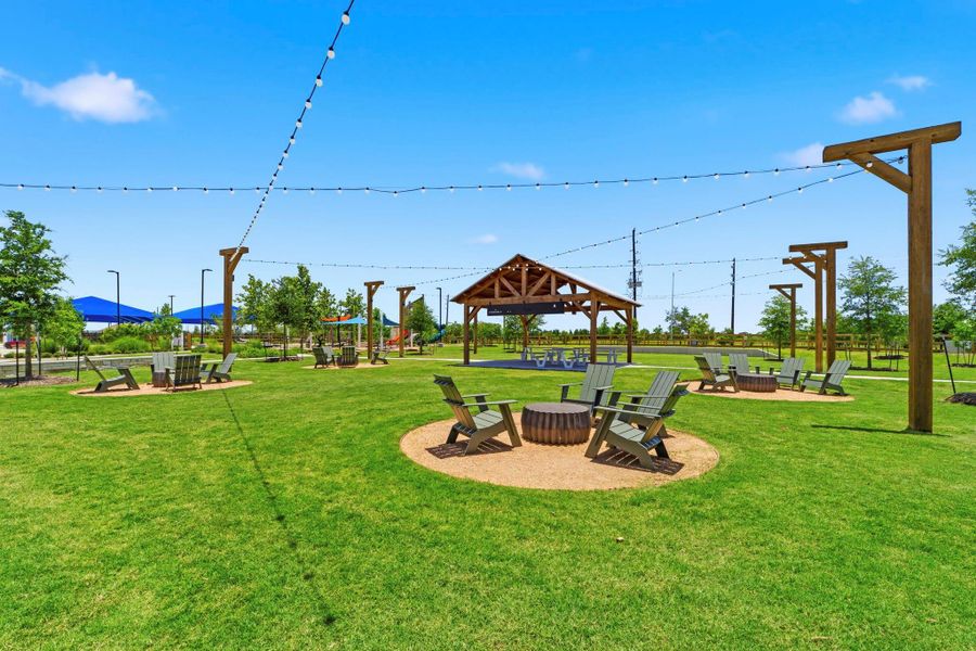 Spacious event lawn with pavilion and gathering areas for community events and outdoor relaxation.