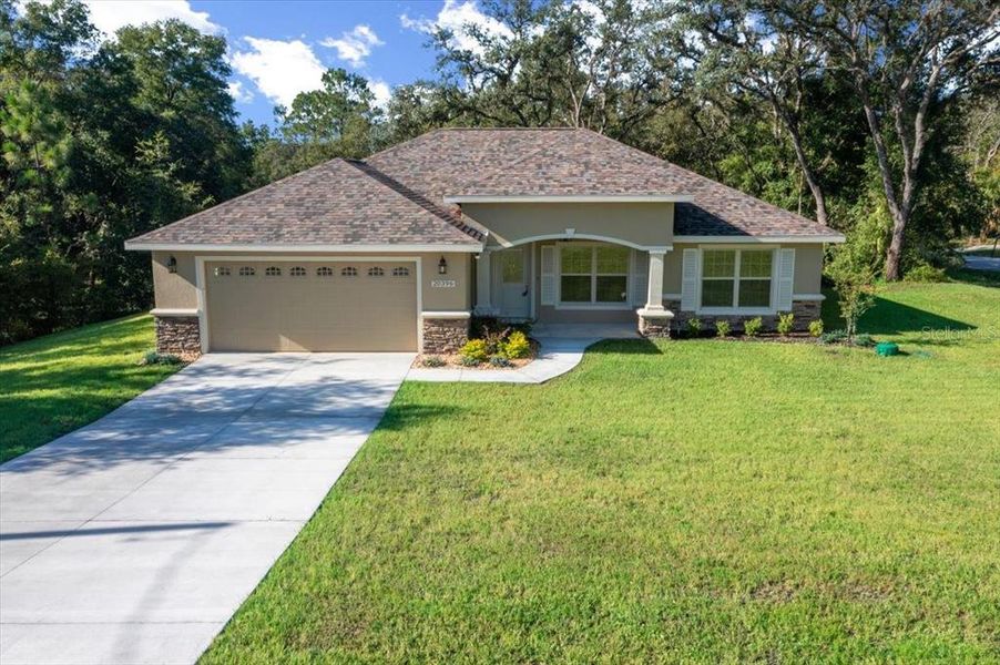 Front exterior of a new home in , Dunnellon, FL, highlighting curb appeal (Image 21).