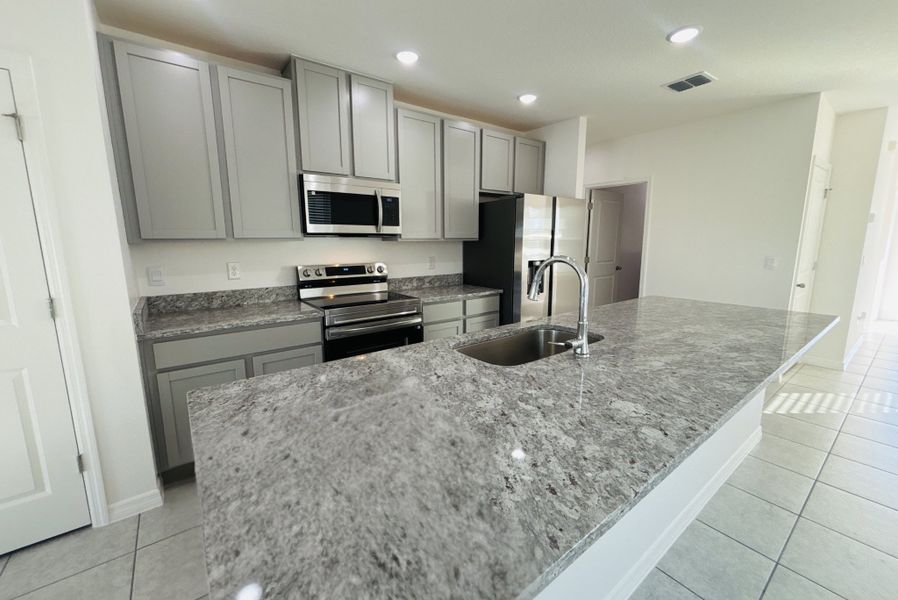 Furnished interior view inside a new home in Lake Deer Estates, Poinciana (Image 7).