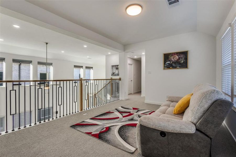 Living area featuring healthy amount of natural light, carpet flooring, and recessed lighting Living area featuring healthy amount of natural light, carpet flooring, and recessed lighting