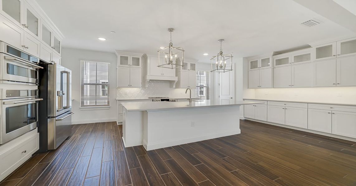 Kitchen with vast center island Kitchen with vast center island