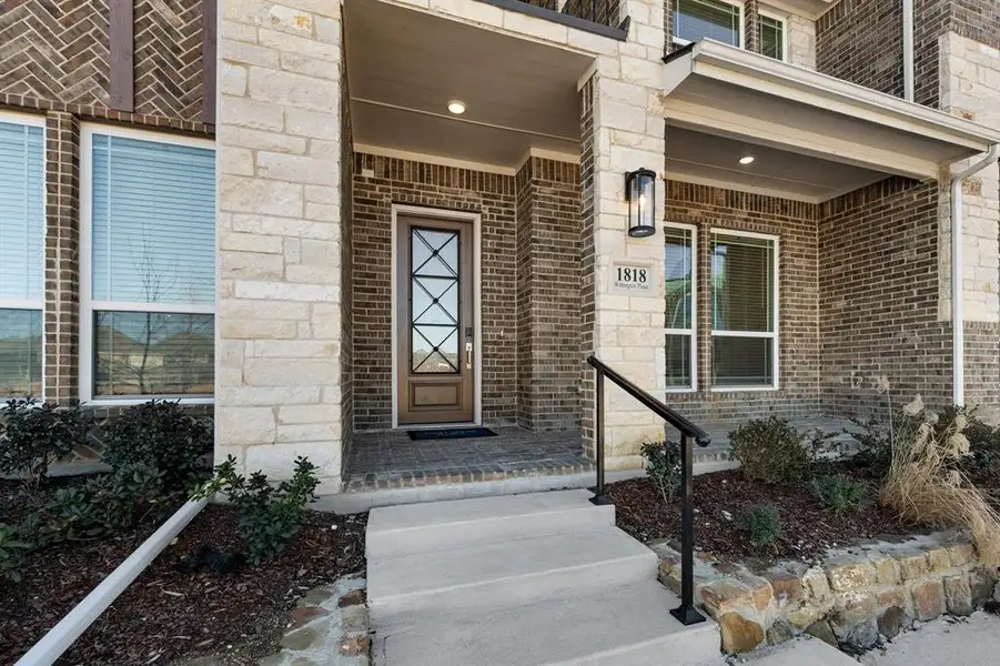 Exterior details and patio area of a home in The Abbey at Mercer Crossing, Farmers Branch (Image 3).