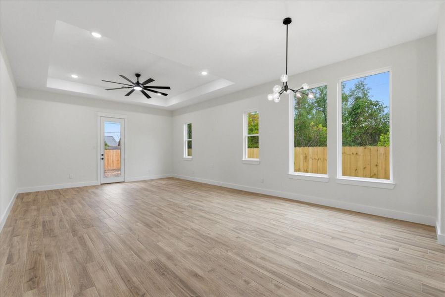 Amply great room showing casing your dining area framed by picture windows, opening up to your spacious living room. Great for entertaining or every day convenient living! Amply great room showing casing your dining area framed by picture windows, opening up to your spacious living room. Great for entertaining or every day convenient living!