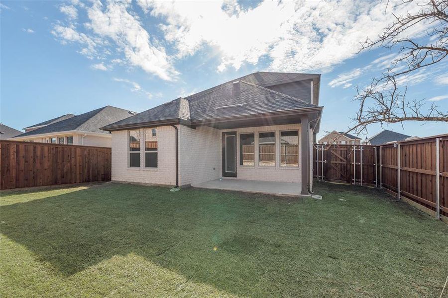 Exterior details and patio area of a home in Spiritas Ranch, Little Elm (Image 22).