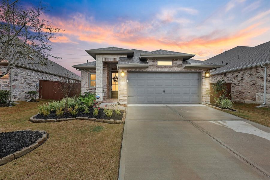 Front exterior of a new home in Meridiana 40'/45', Manvel, TX, highlighting curb appeal (Image 1). Front exterior of a new home in Meridiana 40'/45', Manvel, TX, highlighting curb appeal (Image 1).