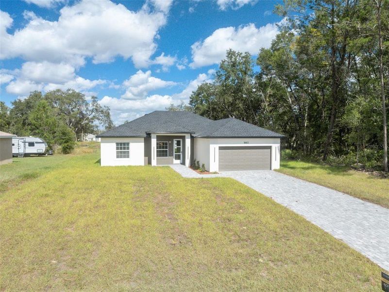 Front exterior of a new home in , Ocala, FL, highlighting curb appeal (Image 20). Front exterior of a new home in , Ocala, FL, highlighting curb appeal (Image 20).