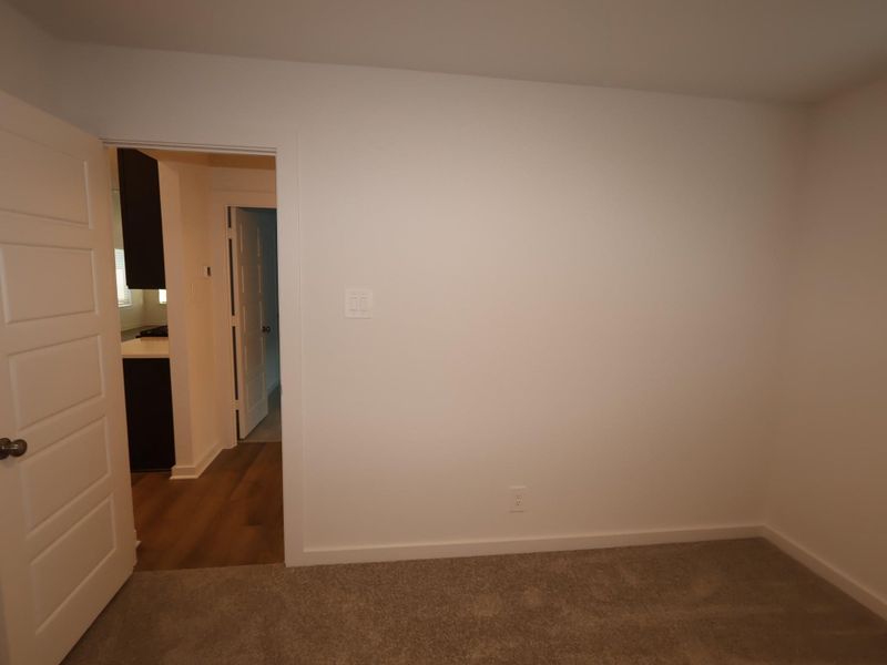 Spacious, unfurnished interior of a new home in Pinewood at Grand Texas, New Caney (Image 8).