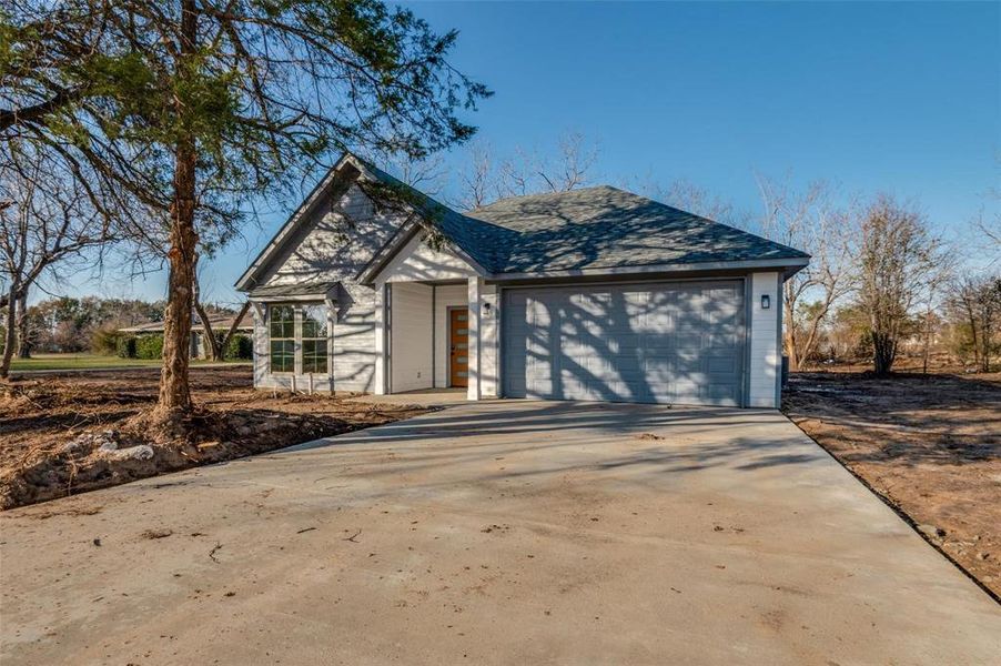 Front exterior of a new home in , Kemp, TX, highlighting curb appeal (Image 1). Front exterior of a new home in , Kemp, TX, highlighting curb appeal (Image 1).