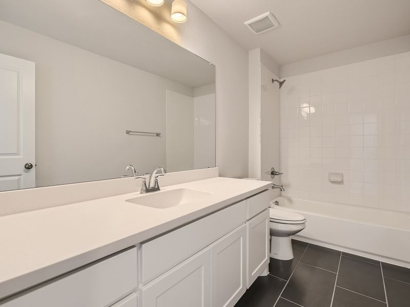 Plan 1533 Secondary Bathroom Representative Photo by American Legend Homes