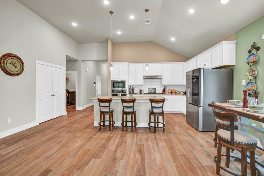 Looking from the living area to the kitchen. Pantry is located behind the double doors Looking from the living area to the kitchen. Pantry is located behind the double doors