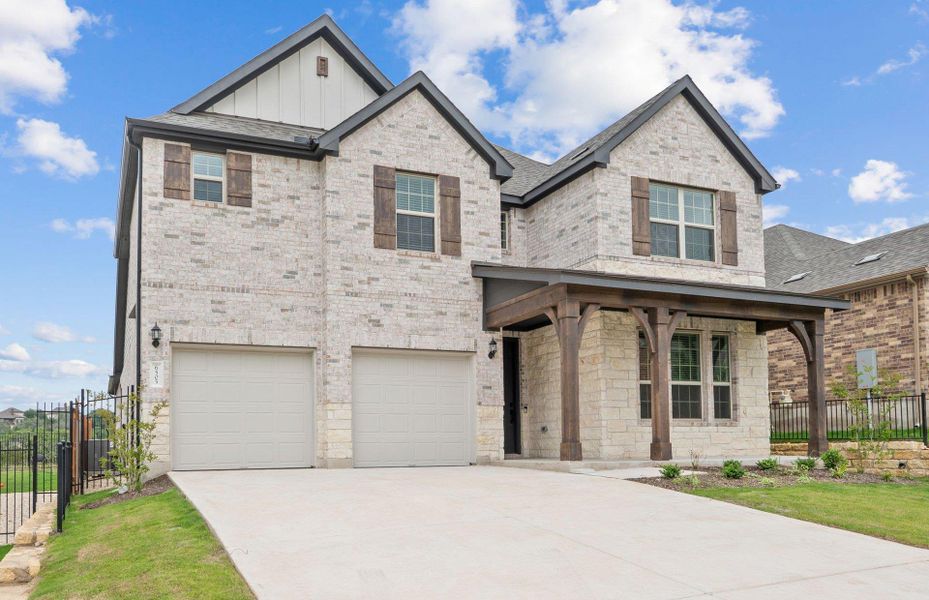 Front exterior of a new home in West Cypress Hills, Spicewood, TX, highlighting curb appeal (Image 13).
