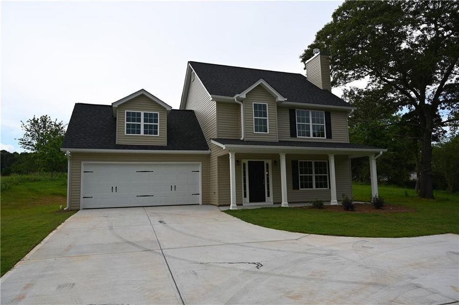 Front exterior of a new home in , Demorest, GA, highlighting curb appeal (Image 1).