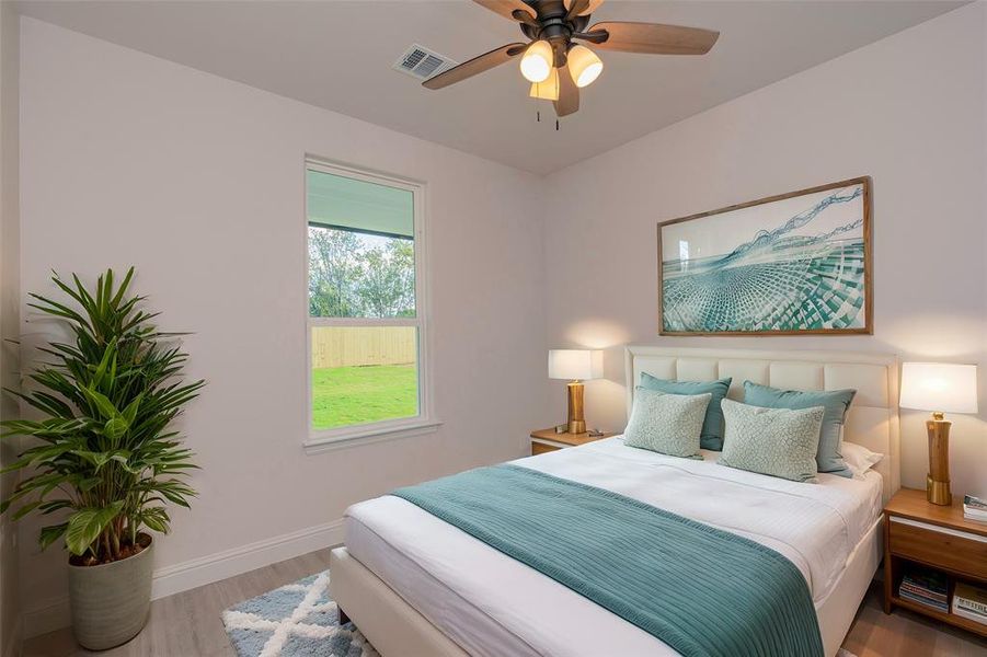 Bedroom featuring light wood-type flooring and ceiling fan