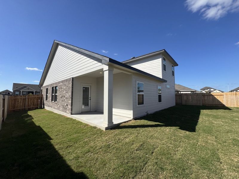 Exterior details and patio area of a home in Village at Three Oaks, Seguin (Image 4).