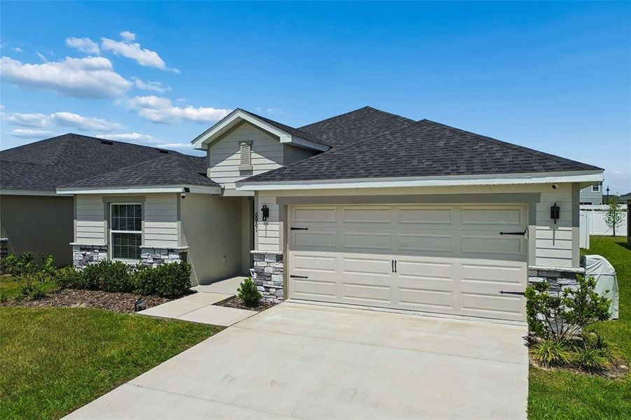 Front exterior of a new home in , Zephyrhills, FL, highlighting curb appeal (Image 29).