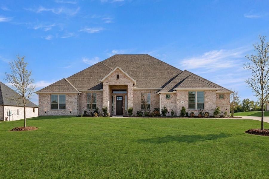 Front exterior of a new home in Heritage, McLendon-Chisholm, TX, highlighting curb appeal (Image 1). Front exterior of a new home in Heritage, McLendon-Chisholm, TX, highlighting curb appeal (Image 1).