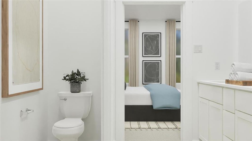 Bathroom featuring vanity and ensuite bath Bathroom featuring vanity and ensuite bath