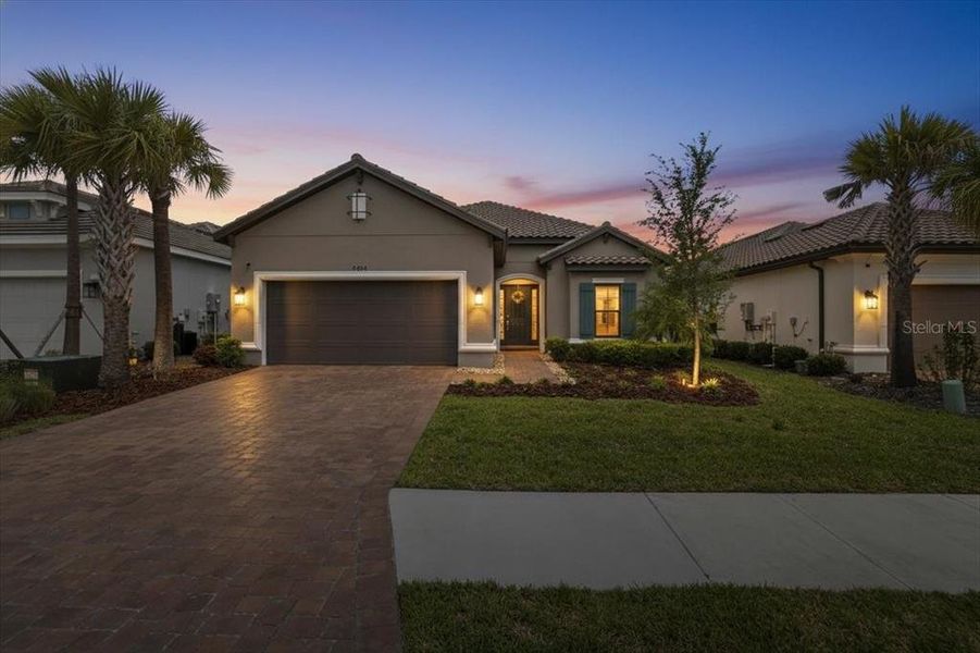 Front exterior of a new home in Esplanade at Artisan Lakes, Palmetto, FL, highlighting curb appeal (Image 21).
