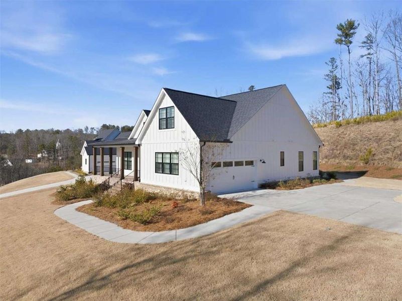 Front exterior of a new home in , Ball Ground, GA, highlighting curb appeal (Image 2). Front exterior of a new home in , Ball Ground, GA, highlighting curb appeal (Image 2).