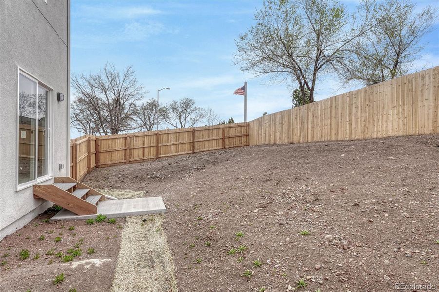 Front exterior of a new home in , Colorado Springs, CO, highlighting curb appeal (Image 23). Front exterior of a new home in , Colorado Springs, CO, highlighting curb appeal (Image 23).