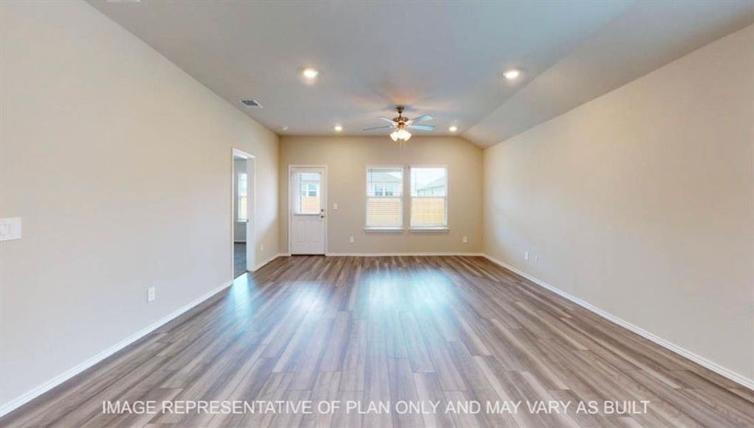 Spacious interior featuring wood-finish flooring, recessed lighting, and a ceiling fan