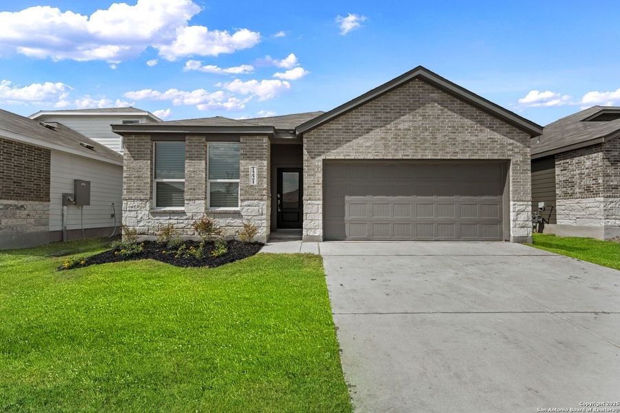 Front exterior of a new home in Parkside: Coastline Collection, New Braunfels, TX, highlighting curb appeal (Image 1).