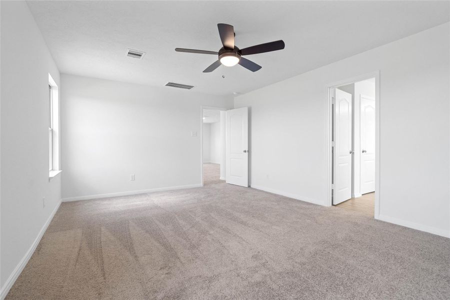 Primary bedroom looking towards primary bathroom.