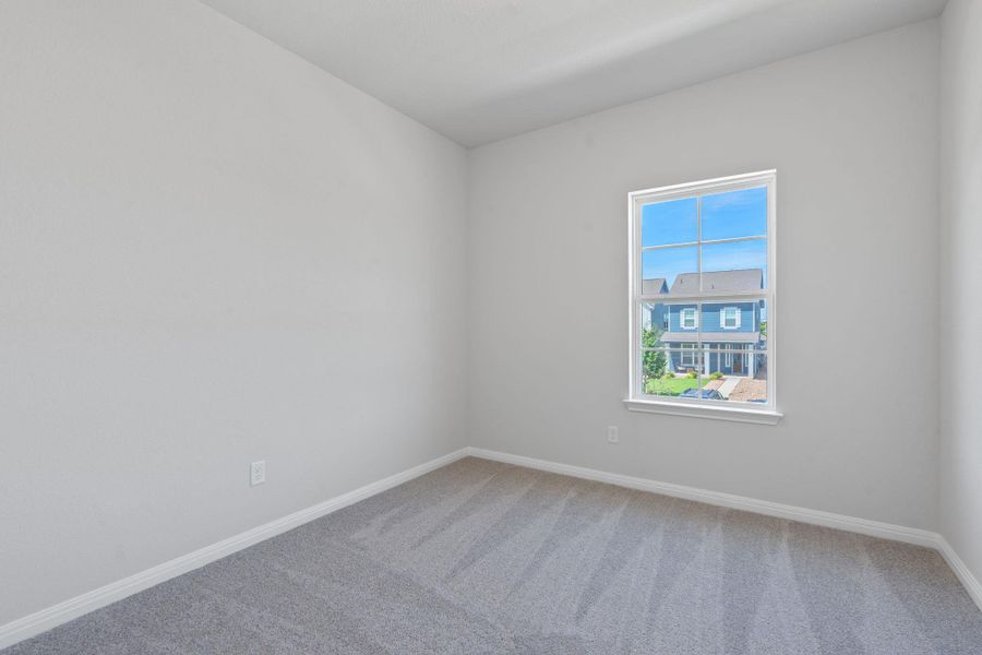 Carpeted spare room with baseboards Carpeted spare room with baseboards