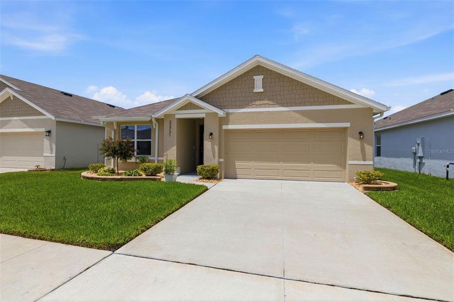 Front exterior of a new home in , Wesley Chapel, FL, highlighting curb appeal (Image 1). Front exterior of a new home in , Wesley Chapel, FL, highlighting curb appeal (Image 1).