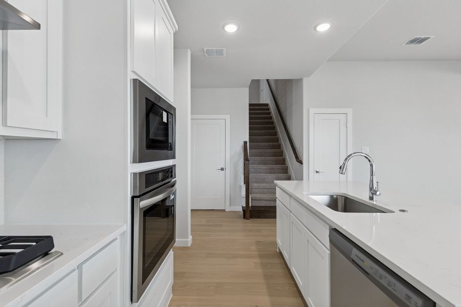 Kitchen in the Stanley II home plan by Trophy Signature Homes – REPRESENTATIVE PHOTO Kitchen in the Stanley II home plan by Trophy Signature Homes – REPRESENTATIVE PHOTO