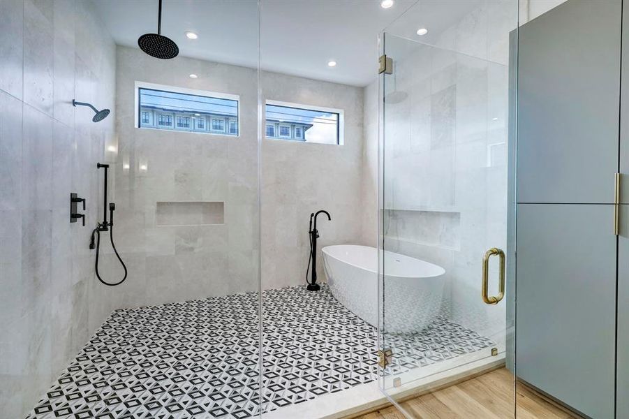 marble primary bath offering glass enclosed wet room plus dual counters