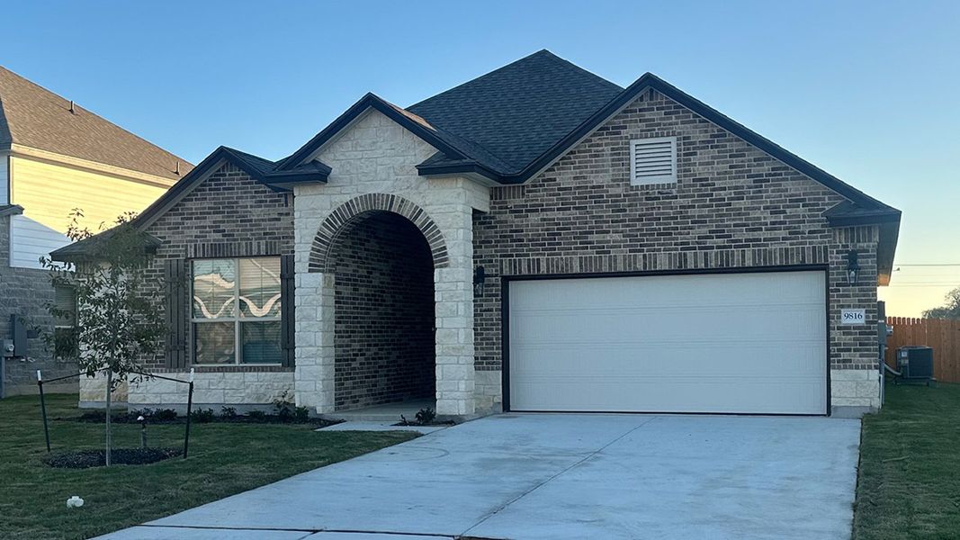 Front exterior of a new home in Saddle Creek, Waco, TX, highlighting curb appeal (Image 2). Front exterior of a new home in Saddle Creek, Waco, TX, highlighting curb appeal (Image 2).