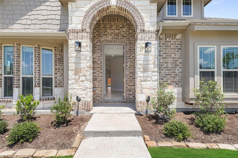 Exterior details and patio area of a home in Hayes Crossing, Midlothian (Image 21).