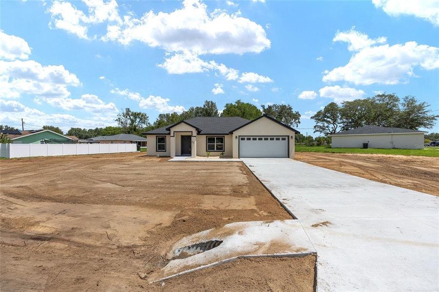 Front exterior of a new home in , Ocala, FL, highlighting curb appeal (Image 28). Front exterior of a new home in , Ocala, FL, highlighting curb appeal (Image 28).