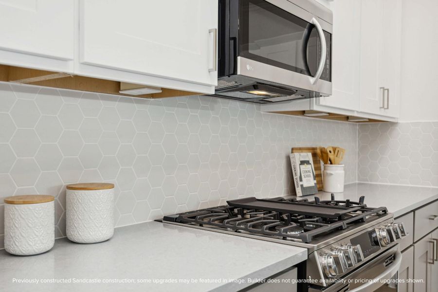 The kind of kitchen details that stop the scroll. Designer-selected backsplash, brushed nickel hardware, and custom cabinetry all come together to make this space seriously swoon-worthy. The kind of kitchen details that stop the scroll. Designer-selected backsplash, brushed nickel hardware, and custom cabinetry all come together to make this space seriously swoon-worthy.