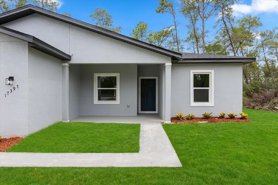 Front exterior of a new home in , Ocala, FL, highlighting curb appeal (Image 1).