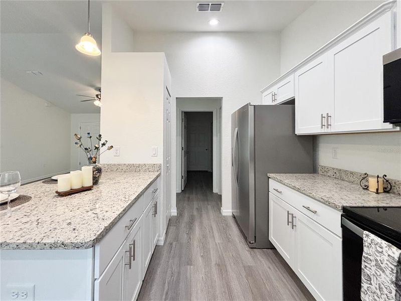 Furnished interior view inside a new home in , Dunnellon (Image 38).